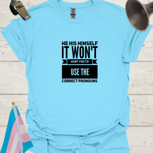 Light blue t-shirt with black text on a wooden surface with a flag and megaphone.
