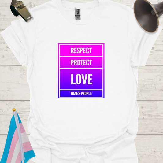 White t-shirt with a pink and purple graphic and text on a wooden surface.