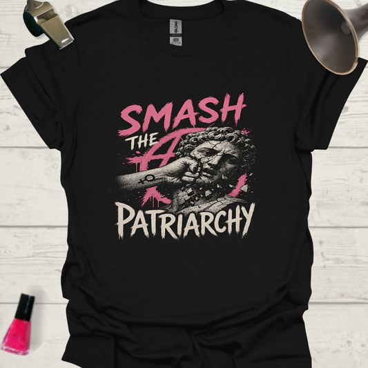 Black t-shirt with 'Smash the Patriarchy' graphic design on a wooden surface.